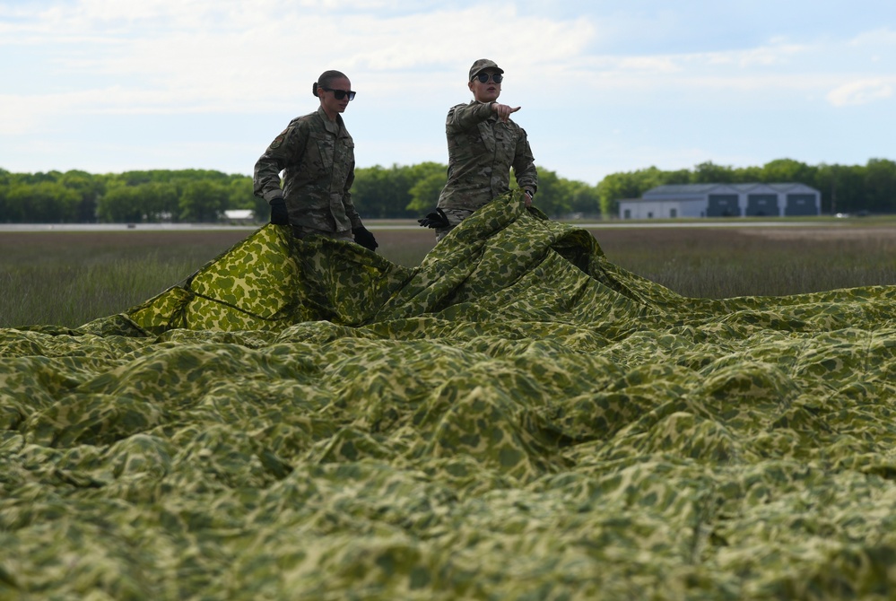 Aerial Port Airmen catch C-130 airdrop during Agile Rage 22