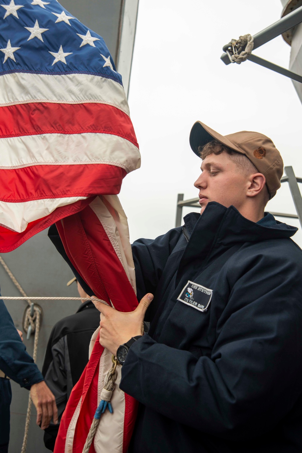 Sailor Lowers Flags On Stethem