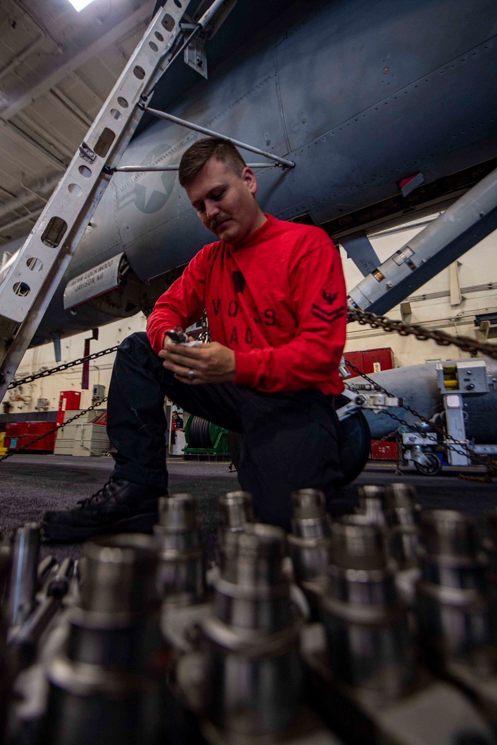 Sailor Cleans Ejector Rack Components