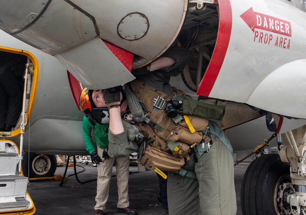 Pilot Inspects Aircraft