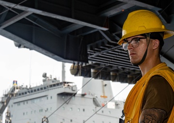 USS Ronald Reagan (CVN-76) conducts a replenishment-at-sea