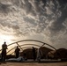 U.S. Airmen and Soldiers construct personnel tents at Camp Lemonnier, Djibouti