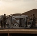 U.S. Airmen and Soldiers construct personnel tents at Camp Lemonnier, Djibouti