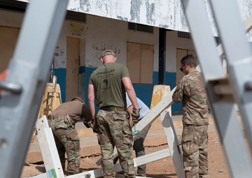 U.S. Airmen and Soldiers provide personal care items and build a swing set at Chabelley Village, Djibouti