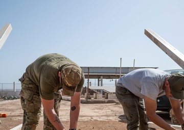 U.S. Airmen and Soldiers provide personal care items and build a swing set at Chabelley Village, Djibouti