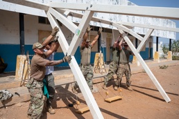 U.S. Airmen and Soldiers provide personal care items and build a swing set at Chabelley Village, Djibouti