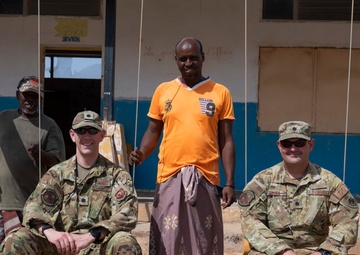 U.S. Airmen and Soldiers provide personal care items and build a swing set at Chabelley Village, Djibouti