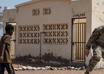 U.S. Airmen and Soldiers provide personal care items and build a swing set at Chabelley Village, Djibouti