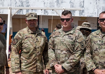 U.S. Airmen and Soldiers provide personal care items and build a swing set at Chabelley Village, Djibouti