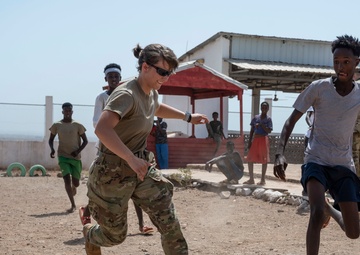 U.S. Airmen and Soldiers provide personal care items and build a swing set at Chabelley Village, Djibouti