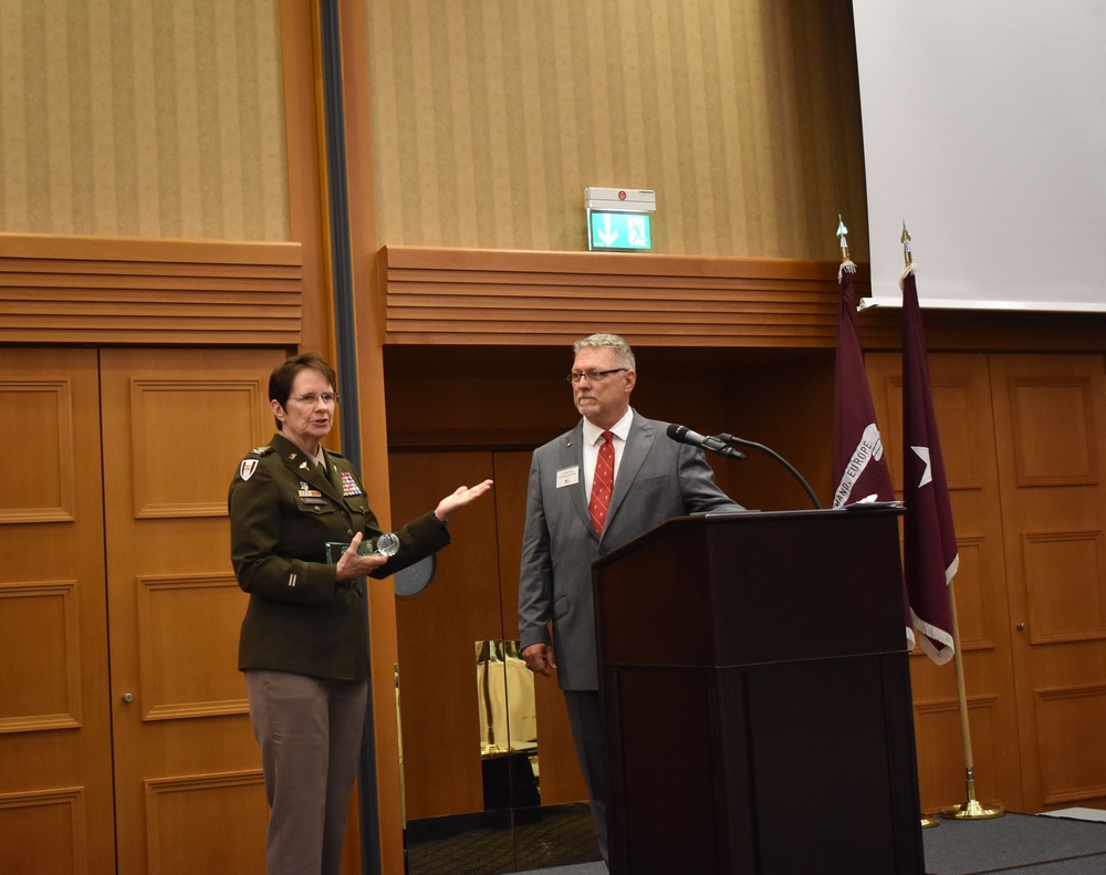 Col. Deborah Whitmer, U.S. Army Veterinary Corps Chief (left) with this year's McNellis guest speaker Air Force retired Col. Donald Noah (right) at the annual International Military Veterinary Symposium in Garmisch-Partenkirchen, Germany.