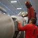 Abraham Lincoln Sailor conducts aircraft maintenance
