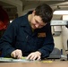 Abraham Lincoln Sailor conducts aircraft maintenance
