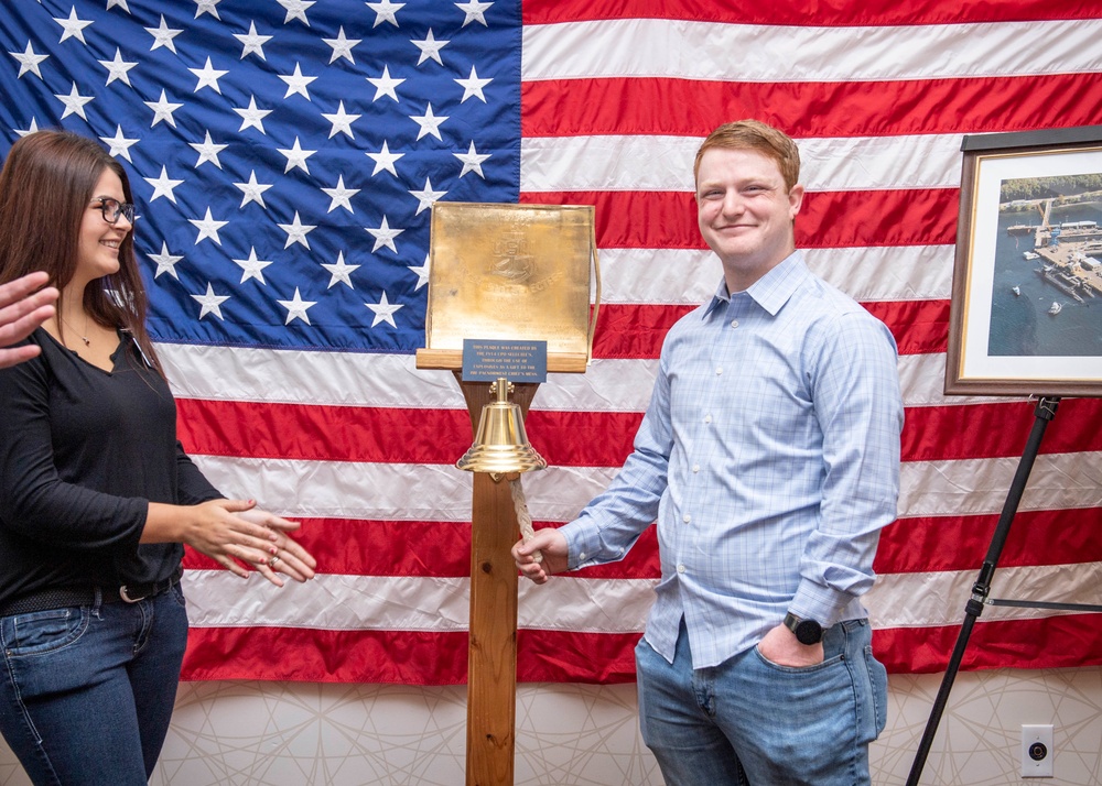 Tentative TRFB Hire Poses for Photo at Job Fair