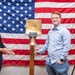 Tentative TRFB Hire Poses for Photo at Job Fair