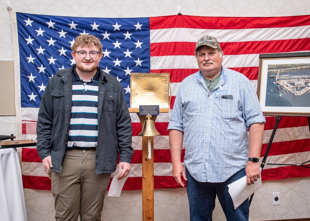 Tentative TRFB Hire Poses for Photo at Job Fair