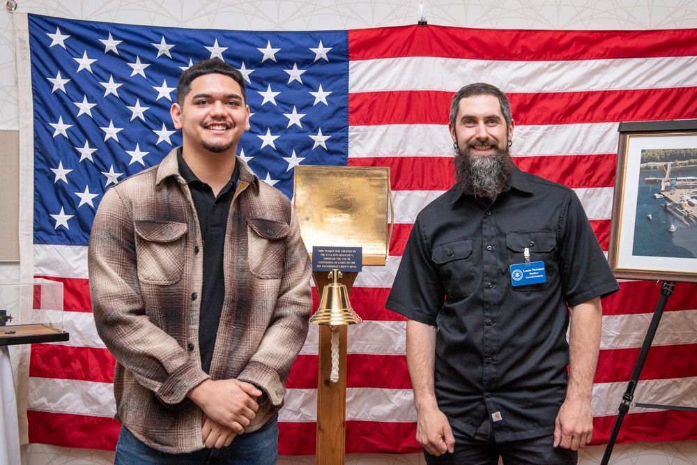 Tentative TRFB Hire Poses for Photo at Job Fair