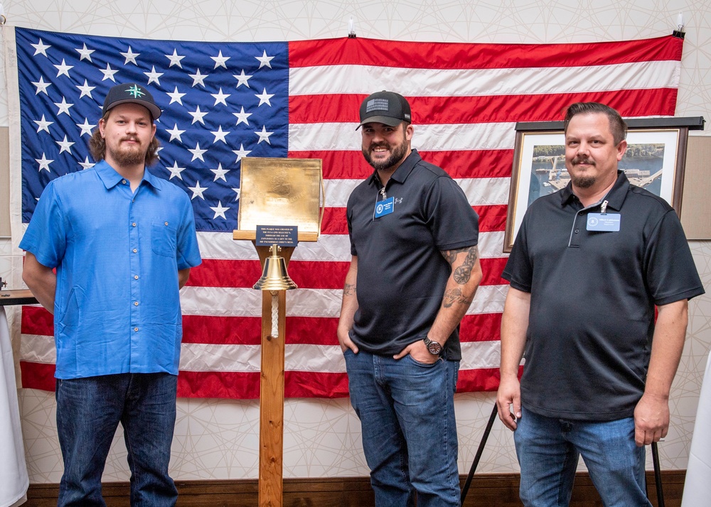 Tentative TRFB Hire Poses for Photo at Job Fair