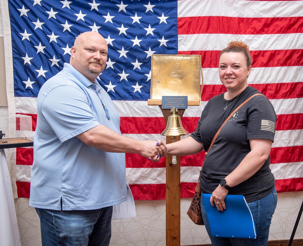 Tentative TRFB Hire Poses for Photo at Job Fair