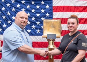 Tentative TRFB Hire Poses for Photo at Job Fair
