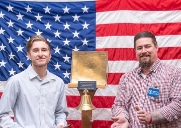 Tentative TRFB Hire Poses for Photo at Job Fair