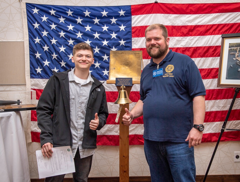 Tentative TRFB Hire Poses for Photo at Job Fair