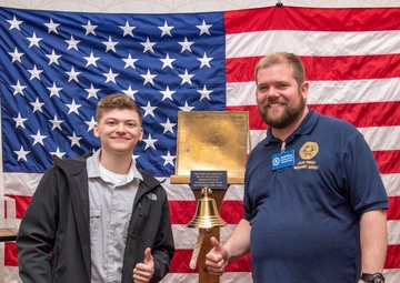Tentative TRFB Hire Poses for Photo at Job Fair