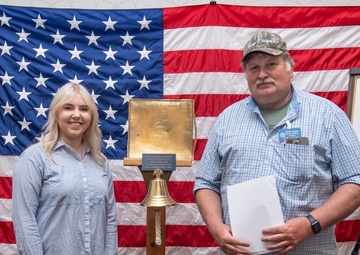 Tentative TRFB Hire Poses for Photo at Job Fair