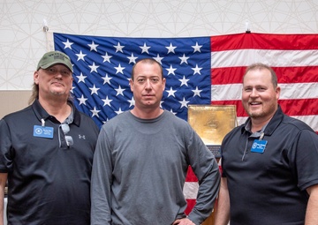 Tentative TRFB Hire Poses for Photo at Job Fair