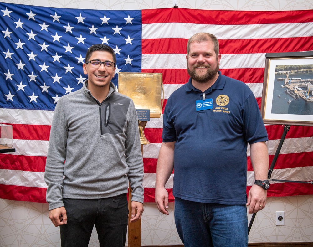 Tentative TRFB Hire Poses for Photo at Job Fair