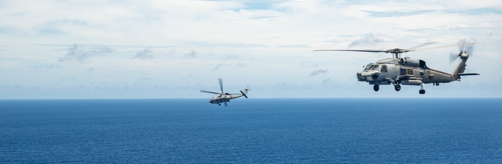 USS Ronald Reagan (CVN 76) Carrier Strike Group conducts formation sailing with USS Abraham Lincoln (CVN 72) carrier strike group