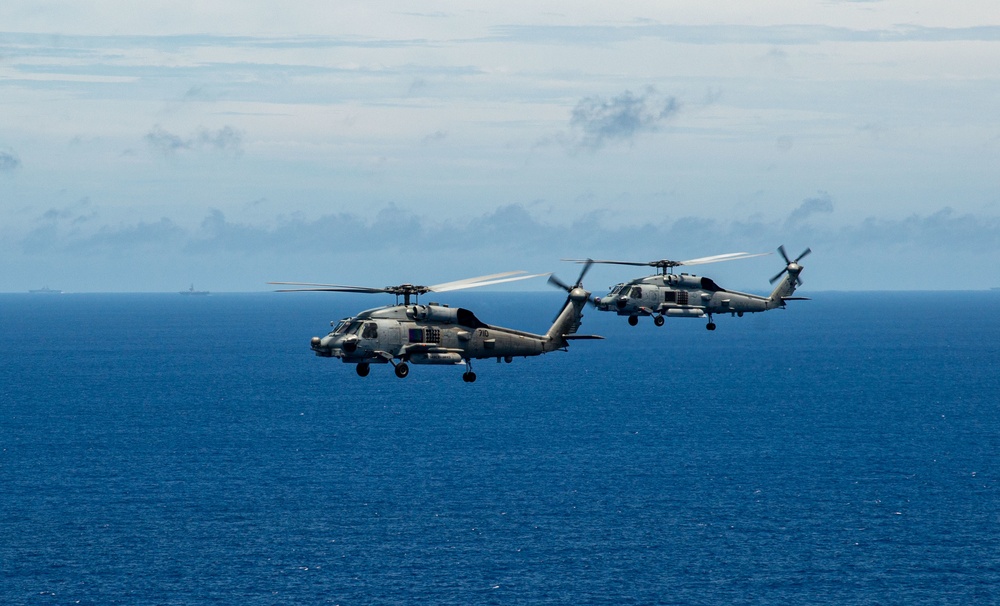 USS Ronald Reagan (CVN 76) Carrier Strike Group conducts formation sailing with USS Abraham Lincoln (CVN 72) carrier strike group