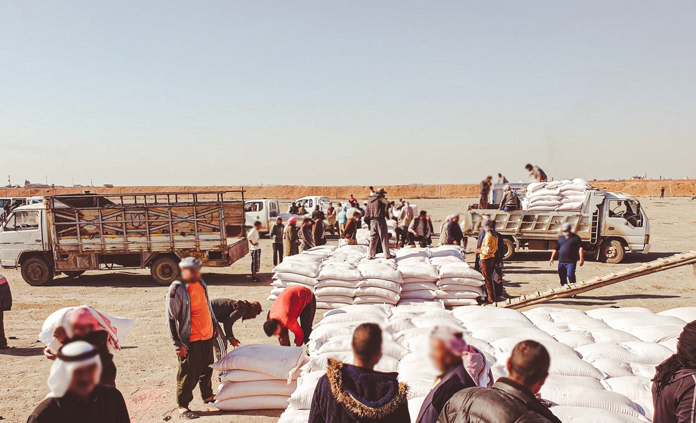 Ya'aroubyah, Farmers loading USAID treated wheat seed at the distribution site