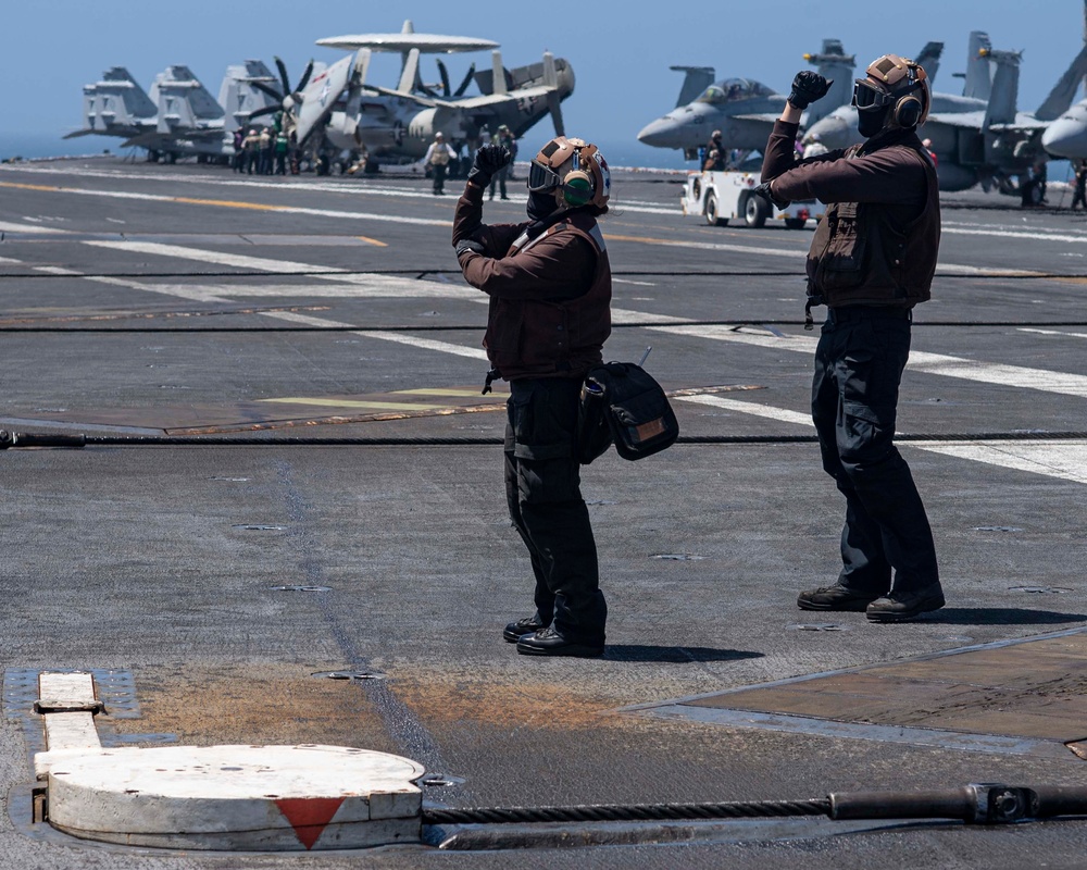 Sailors Signal Aircraft For A Safety Test