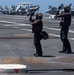 Sailors Signal Aircraft For A Safety Test