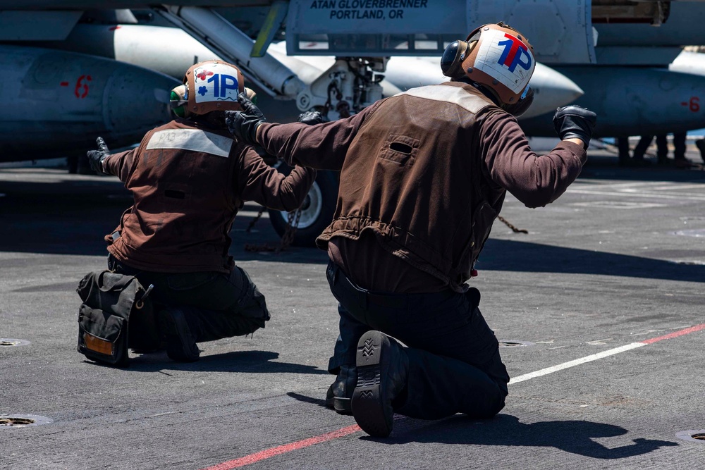 Sailors Signal Aircraft For A Safety Test