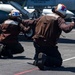 Sailors Signal Aircraft For A Safety Test