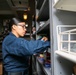 Abraham Lincoln Sailor conducts inventory