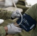 Soldier checks vital signs during Global Medic