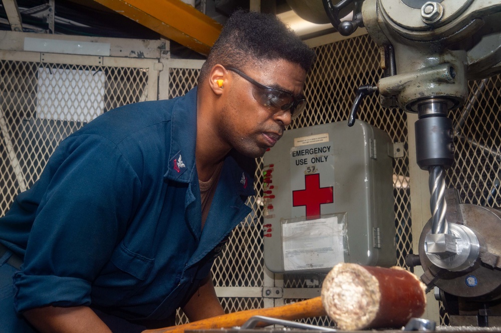 USS Ronald Reagan machine shop Sailors manufacture tools underway