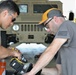 Mechanics from military police units turn wrenches