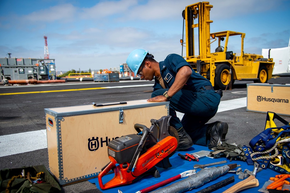 USS Carl Vinson (CVN 70) Sailors Pre-Stage Damage Control Equipment