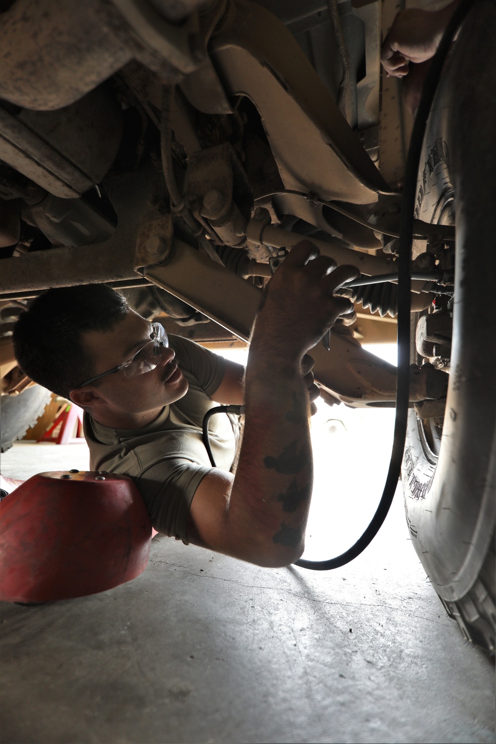 Mechanics from military police units turn wrenches