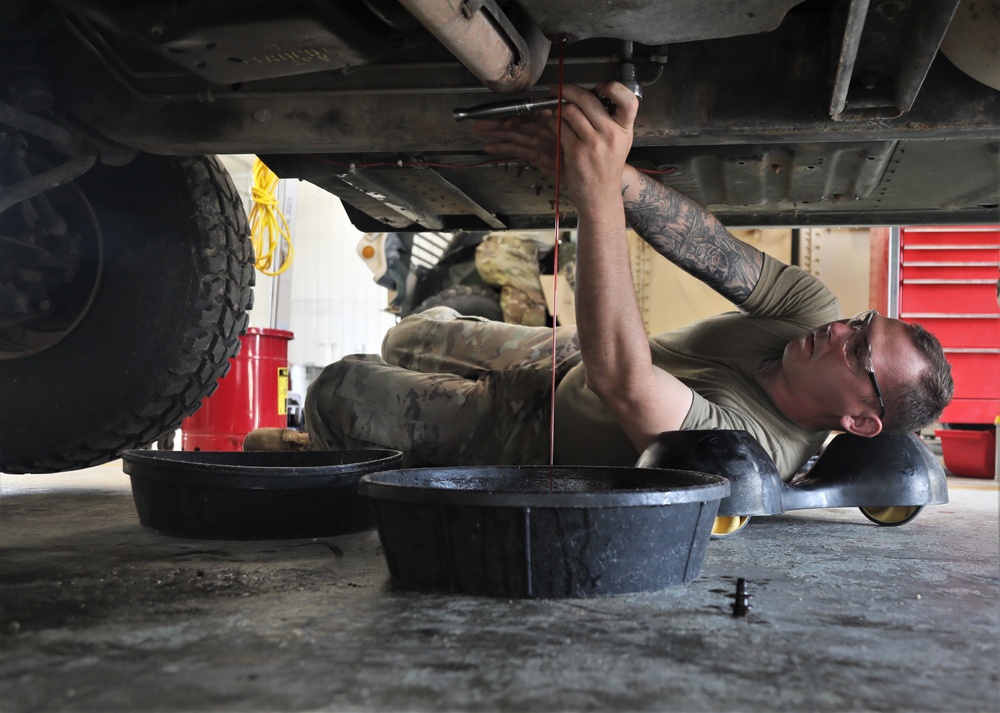 Mechanics from military police units turn wrenches