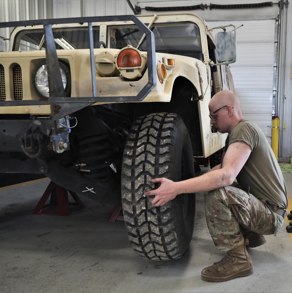 Mechanics from military police units turn wrenches