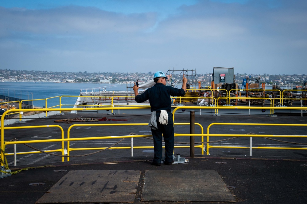 USS Carl Vinson (CVN 70) Sailor Raises Aircraft Elevator