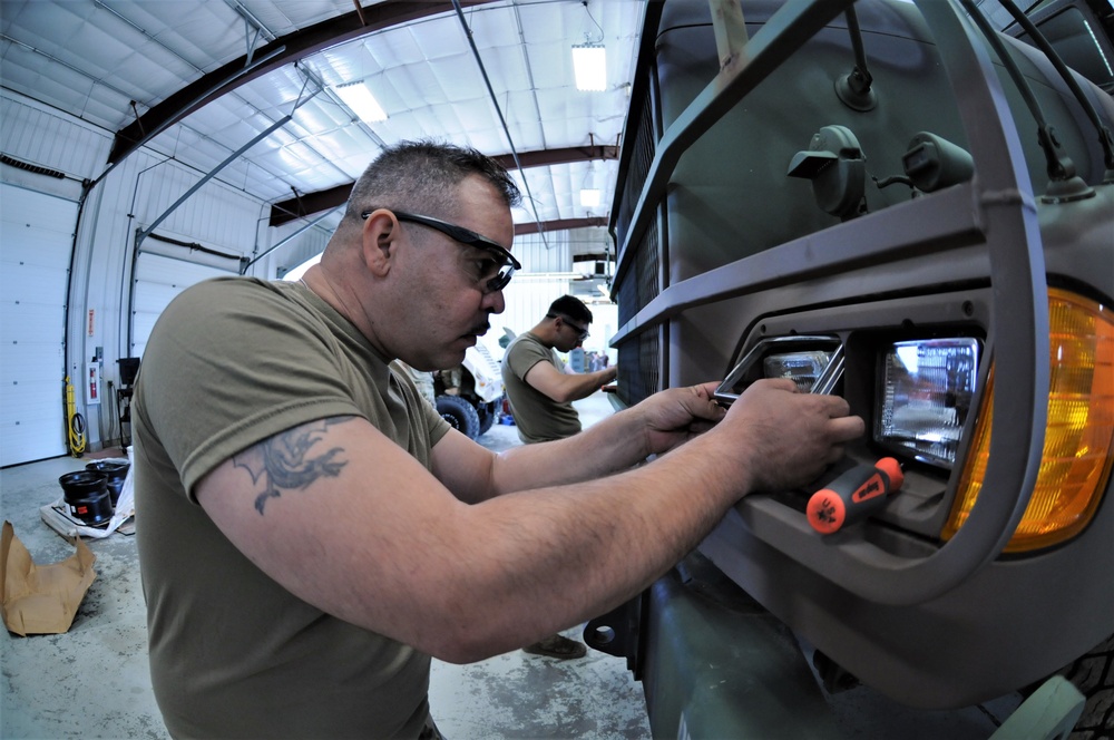 Mechanics from military police units turn wrenches