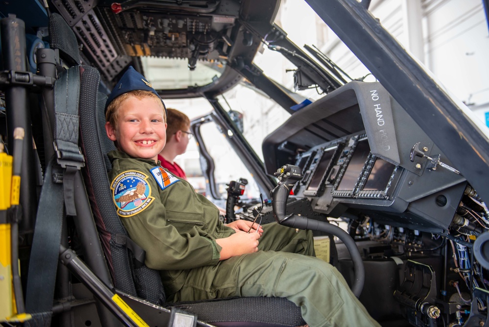 Coast Guard Aviation Training Center Mobile awards 7-year-old boy honorary aviator title