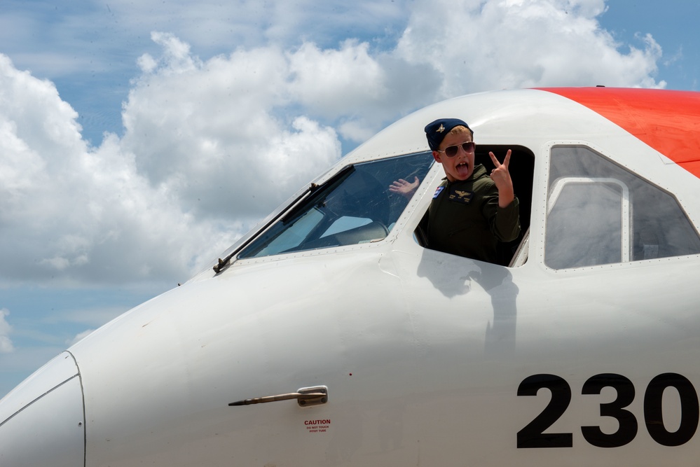 Coast Guard Aviation Training Center Mobile awards 7-year-old boy honorary aviator title