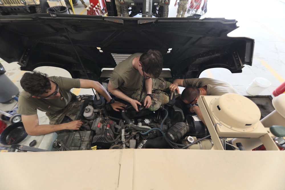 Mechanics from military police units turn wrenches